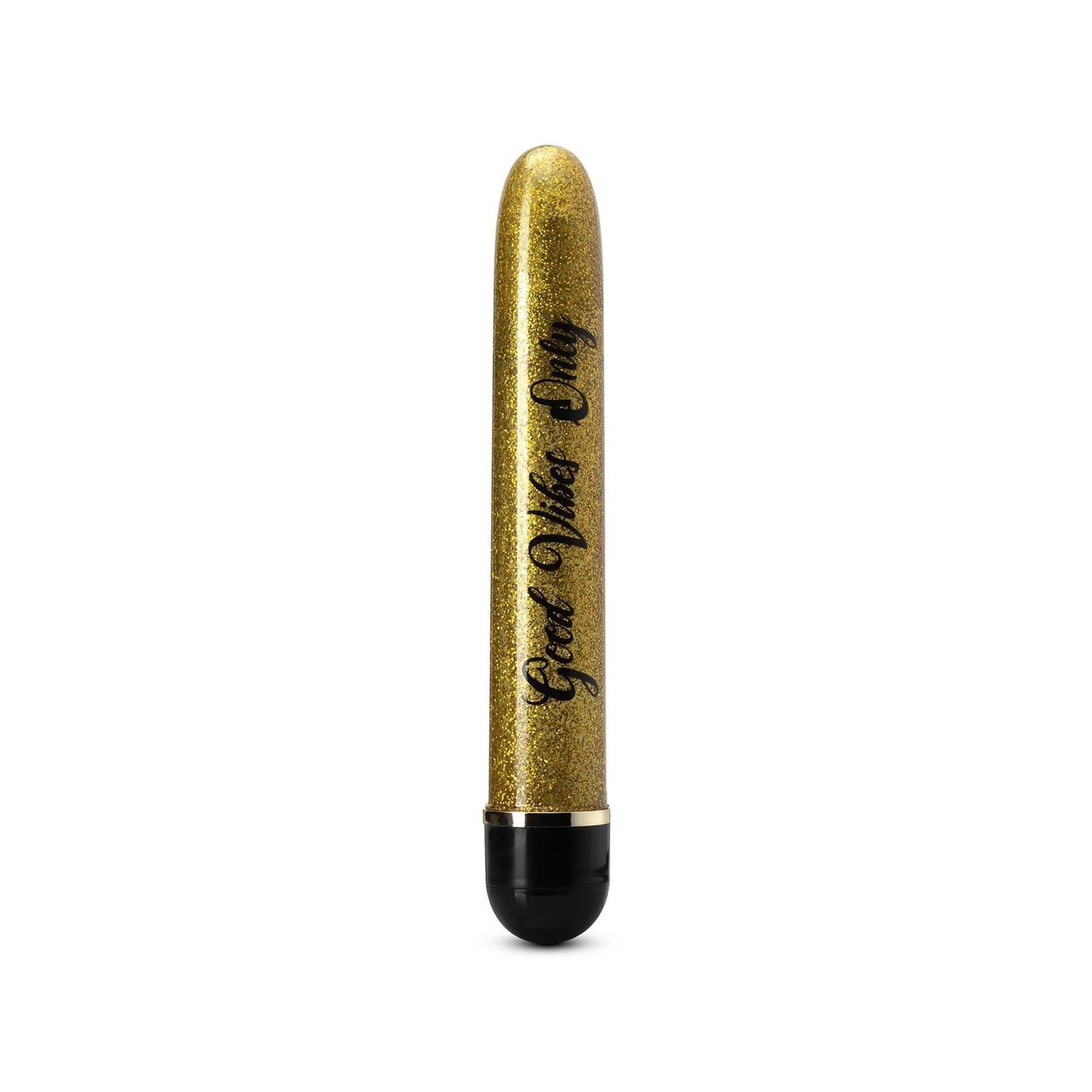 Goldfarbener Vibrator mit schwarzem Ende. Aufschrift 'Good Vibes Only'.