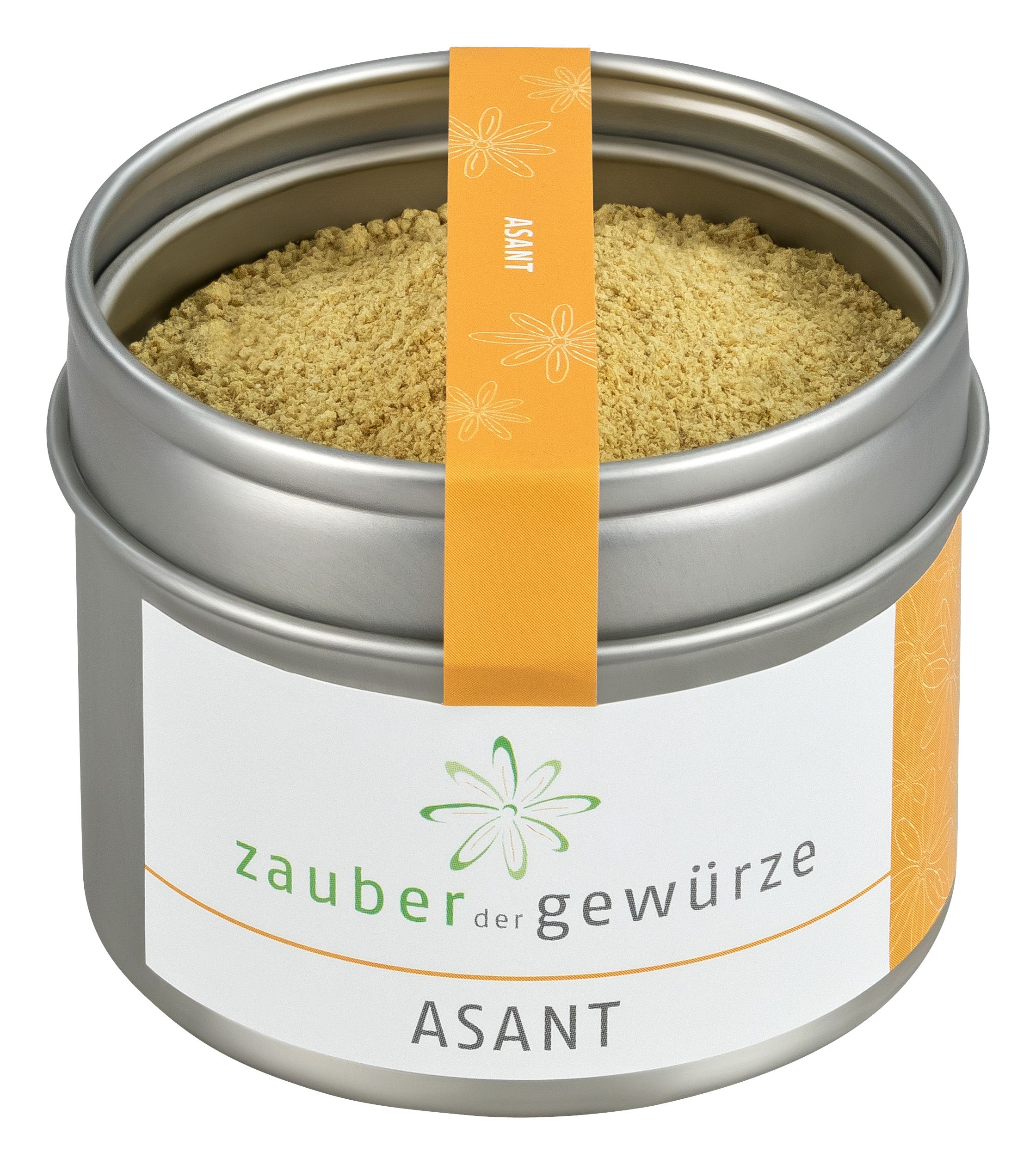 Runde Dose mit gelbem Pulver. Etikett mit "Zauber der Gewürze" und "Asant". Orangefarbener Streifen mit "Asant".