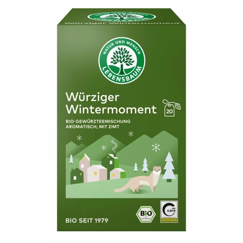 Grüne Teebox mit "Würziger Wintermoment". Logo: Baum in Kreis. Text: Bio-Gewürzteemischung, aromatisch, mit Zimt. Bio-Siegel und C-Care-Siegel.