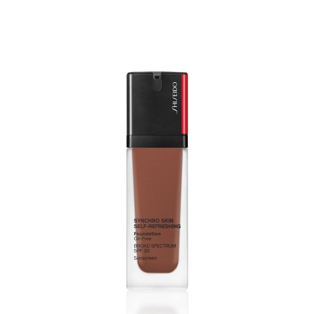 Flüssige Foundation in Glasflasche. Schwarzer Deckel mit rotem Akzent. Text: Synchro Skin, SPF 30, Oil-Free.
