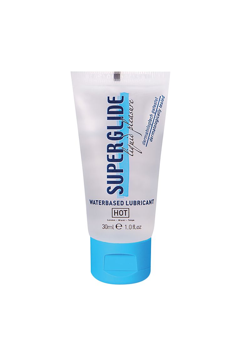 Transparentes Tube mit blauem Verschluss. Aufschrift: SUPERGLIDE liquid pleasure WATERBASED LUBRICANT. 30ml. HOT. Dermatologisch getestet.