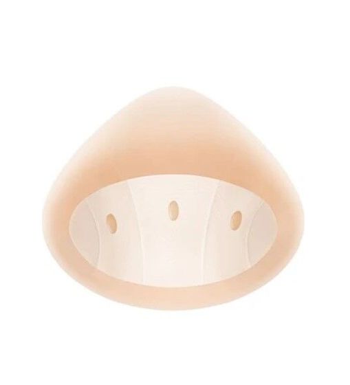 Ausgleichsepithese, Innenseite. Dreieckige Form mit drei Öffnungen. Hautfarbenes Material.