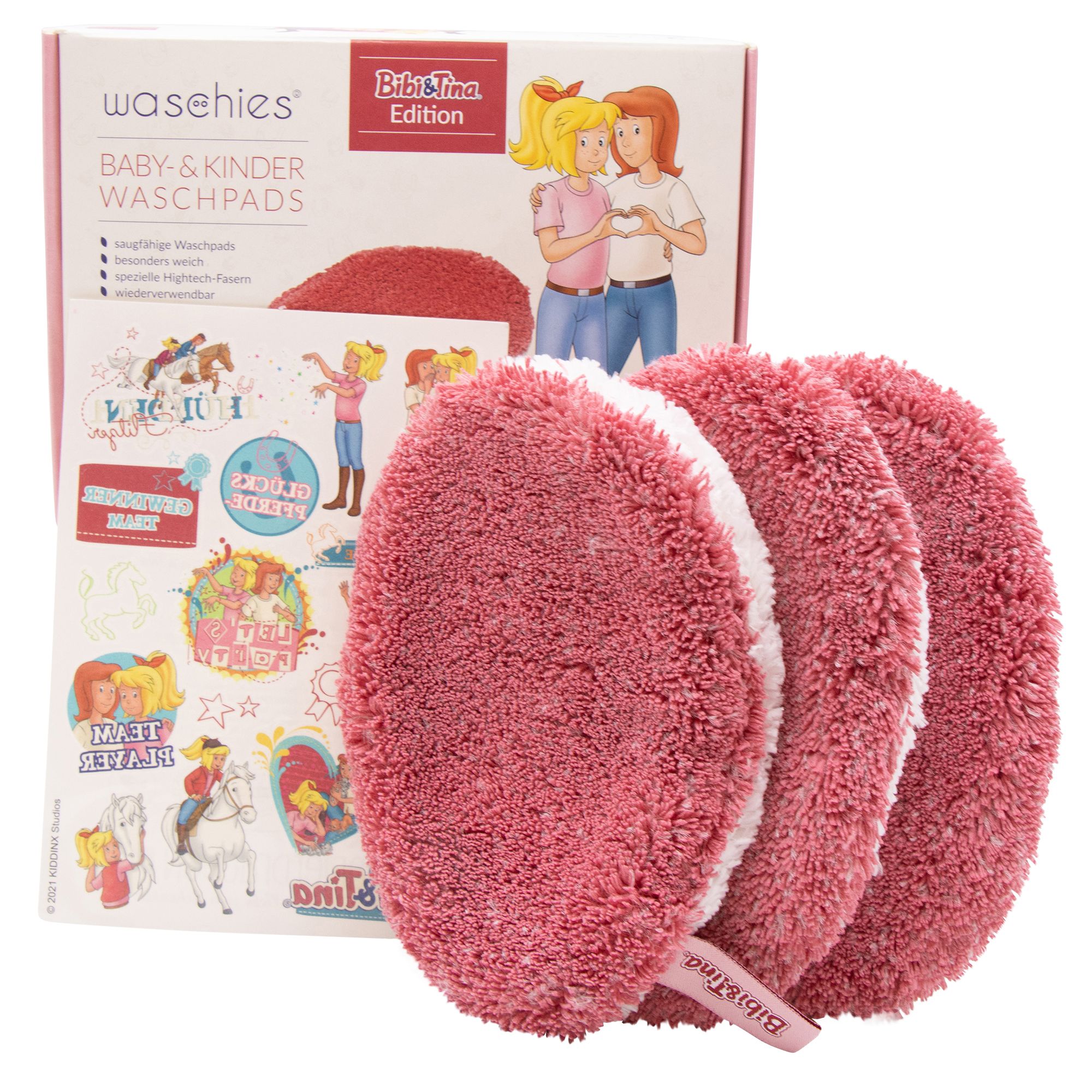 Drei magenta Waschpads mit weißem Rand, neben Verpackung mit Bibi & Tina-Illustrationen und Aufklebern.