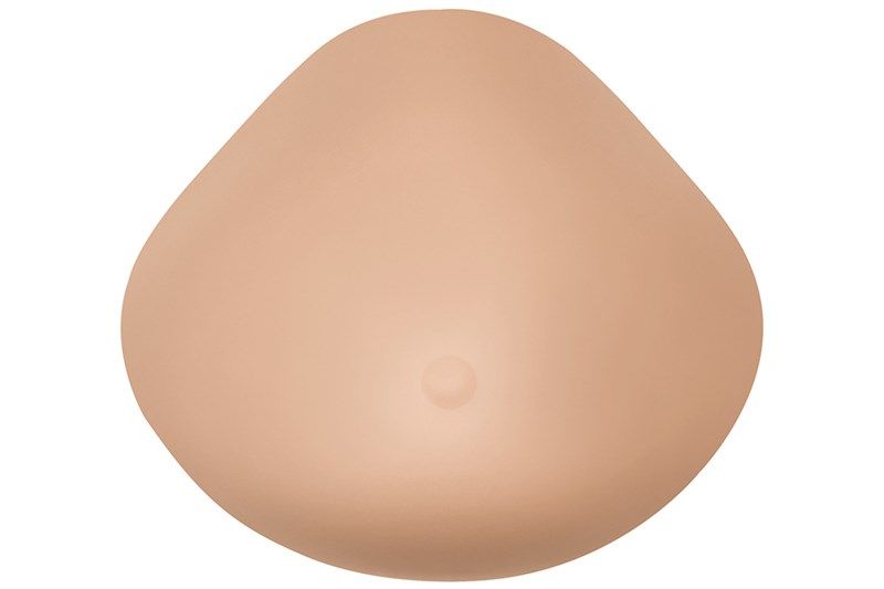 Brustprothese in Hautfarbe mit Nippel. Tropfenförmig, leicht gewölbt.