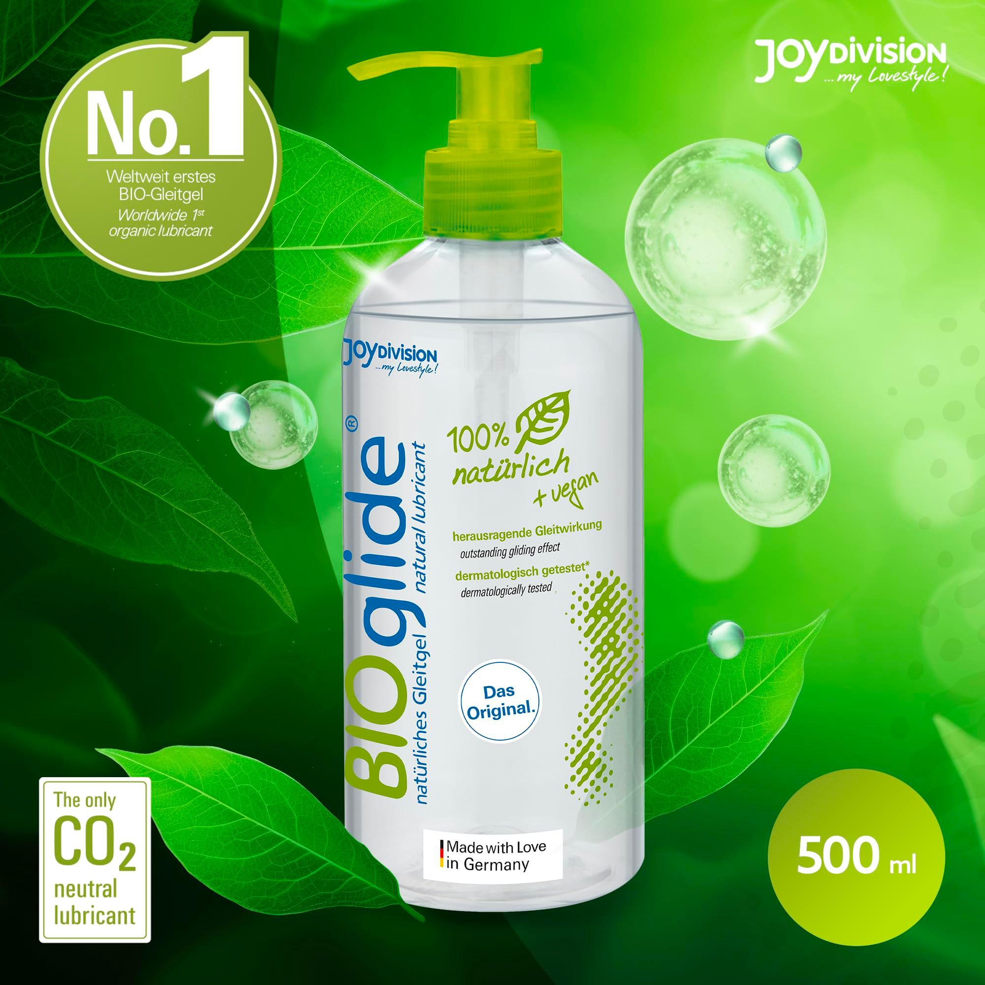 BIOglide Gleitgel Flasche mit Pumpspender, umgeben von grünen Blättern und Blasen.