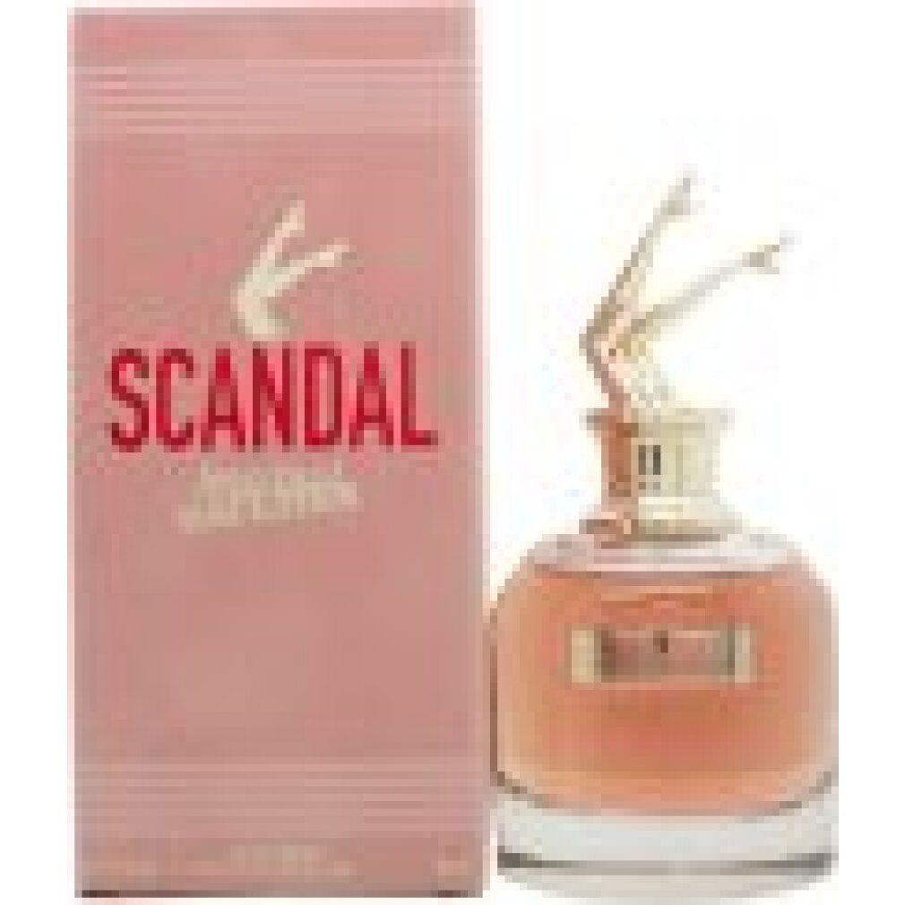 Parfümflakon mit goldfarbenem Bein-Deckel und rosa Verpackung. Aufschrift "SCANDAL" und "Jean Paul Gaultier".
