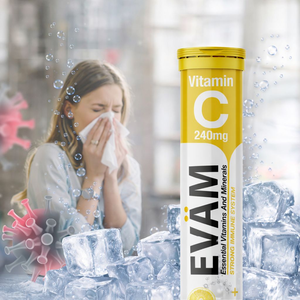 Frau mit Taschentuch, neben Tube mit EVÄM Vitamin C. Aufschrift: Vitamin C 240mg. Eiswürfel und Viren im Hintergrund.