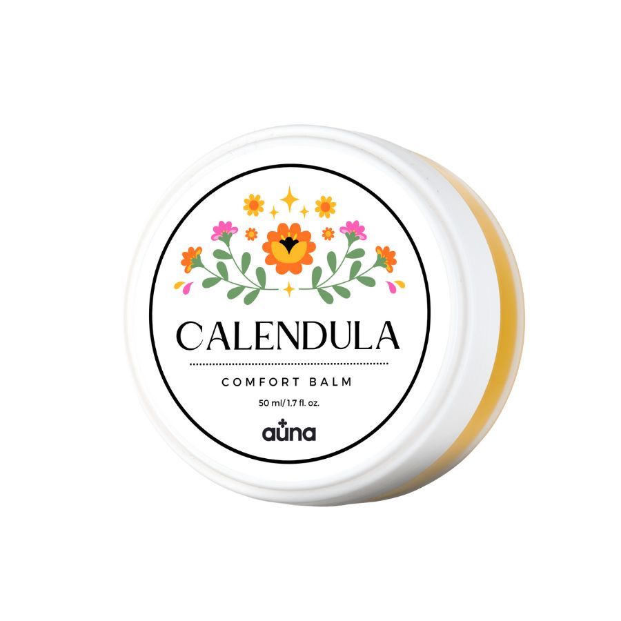 Runde Dose mit Deckel. Aufschrift: CALENDULA COMFORT BALM. Blumenmuster. Marke: auna. Gelber Balsam sichtbar.