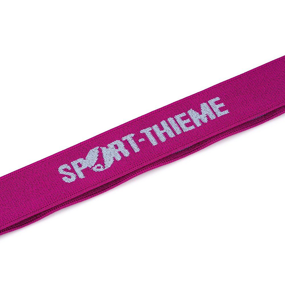 Nahaufnahme eines pinkfarbenen Elastikbands. Aufschrift "SPORT-THIEME" in Weiß.