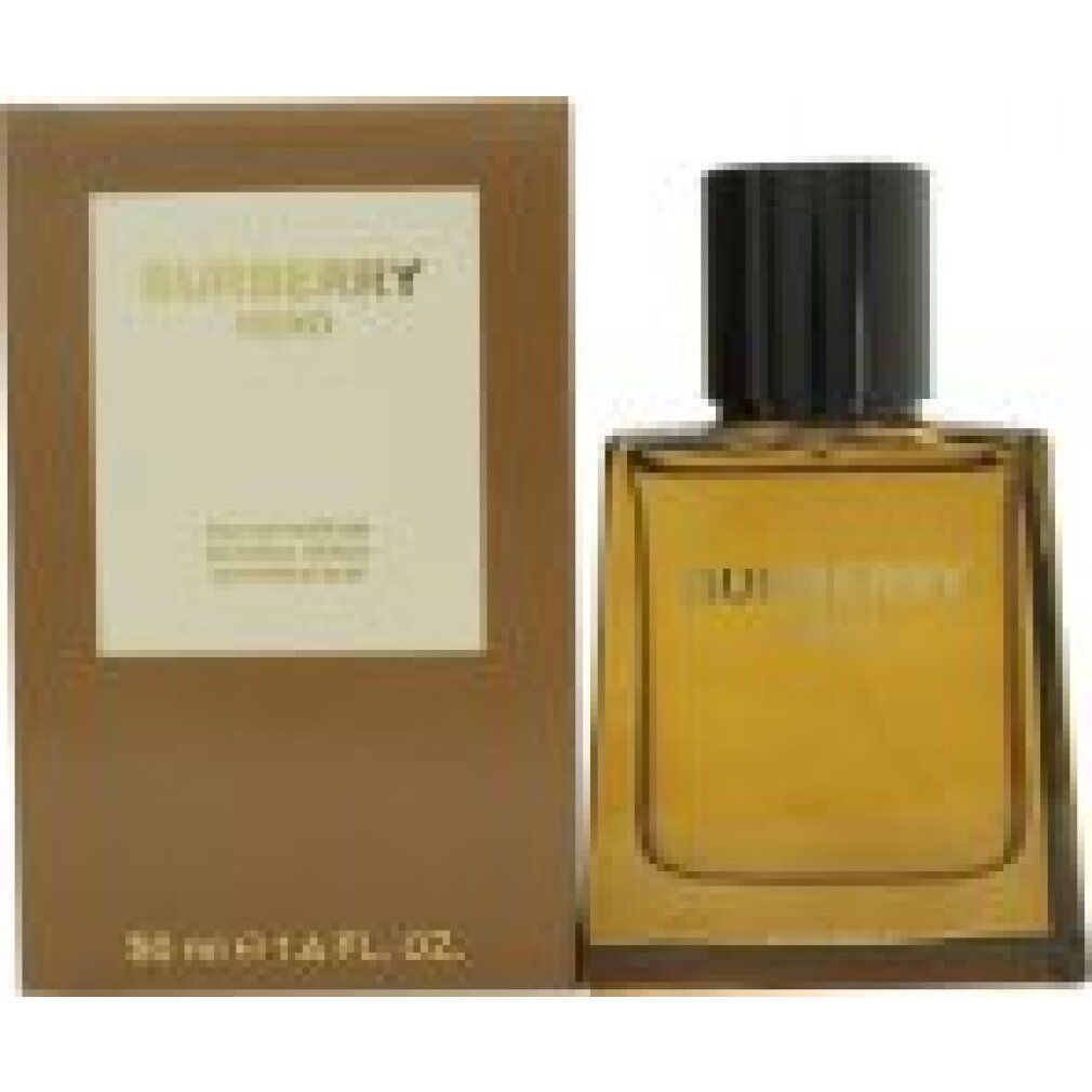 Burberry Hero E.d.P. Nat. Spray und Verpackung. Braune Flasche, schwarzer Deckel. Goldener Schriftzug. Braune Verpackung.