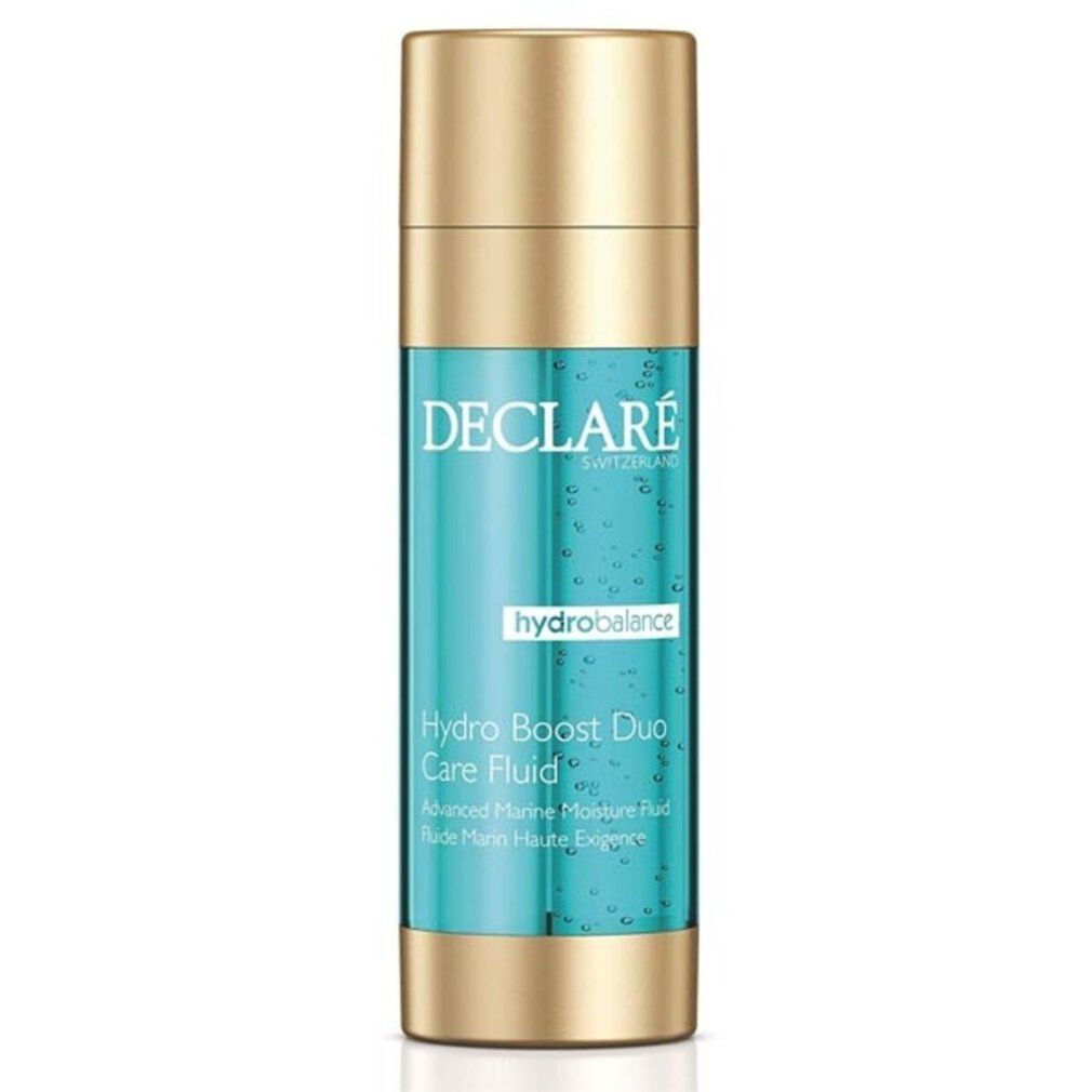 Zylindrische Flasche mit goldfarbenem Deckel und Boden. Türkis-farbener Inhalt. Beschriftung: DECLARE, hydrobalance, Hydro Boost Duo Care Fluid.