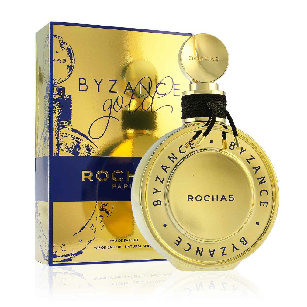 Rochas Byzance Gold Eau de Parfum Flakon neben seiner goldenen Schachtel.