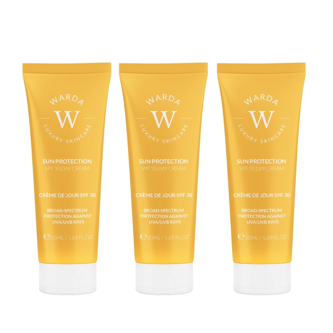 Drei gelbe Tuben mit weißem Deckel. Aufschrift: Warda Luxury Skincare, Sun Protection SPF 30 Day Cream.