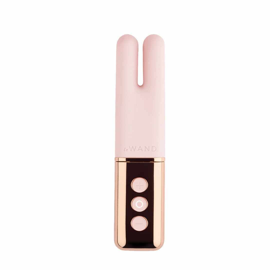 Rosa Vibrator mit goldfarbenen Akzenten. Drei Knöpfe. Marke: Le Wand.