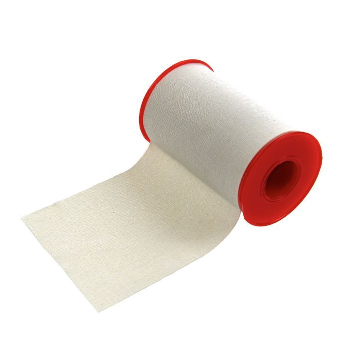 Rolle Zinkoxid Heftpflaster, teilweise abgerollt. Roter Rand. Aufschrift: Romed, HOLLAND, PLASTER.