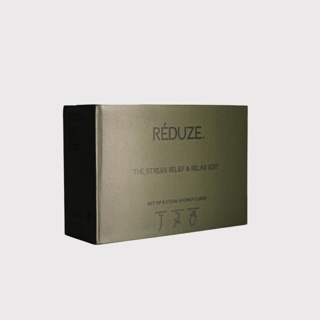 Dunkelgrüne Box mit "RÉDUZE"-Logo. Text: "THE STRESS RELIEF & RELAX EDIT". Aufgedruckte Symbole.