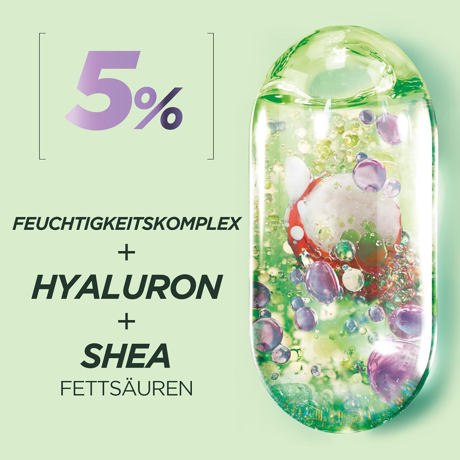 Nahaufnahme von Inhaltsstoffen in einer Flüssigkeit. Text: 5%, Feuchtigkeitskomplex, Hyaluron, Shea Fettsäuren.