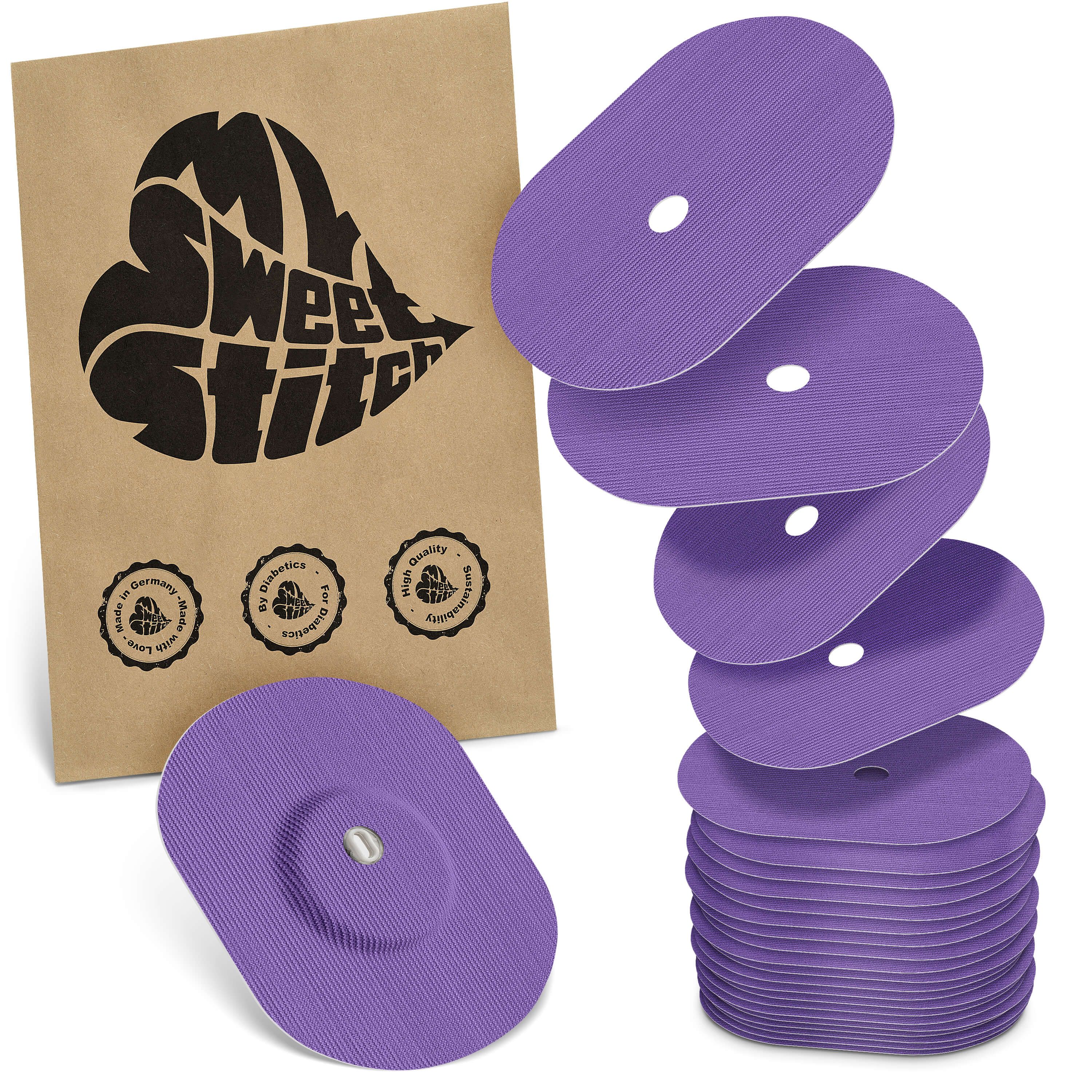 Ovalförmige, lilafarbene Pflaster mit Loch in der Mitte. Eine Packung mit dem Logo MySweetStitch und Qualitätszeichen.