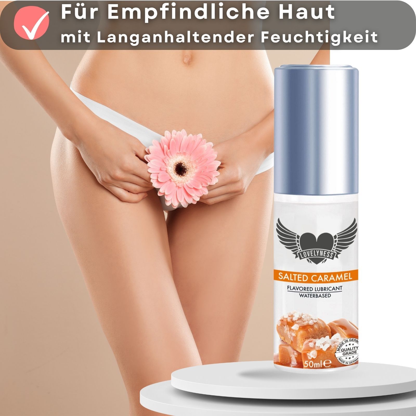 Gleitgel mit Aroma Caramel. Flasche mit silbernem Deckel. Für empfindliche Haut. Rosa Blume.