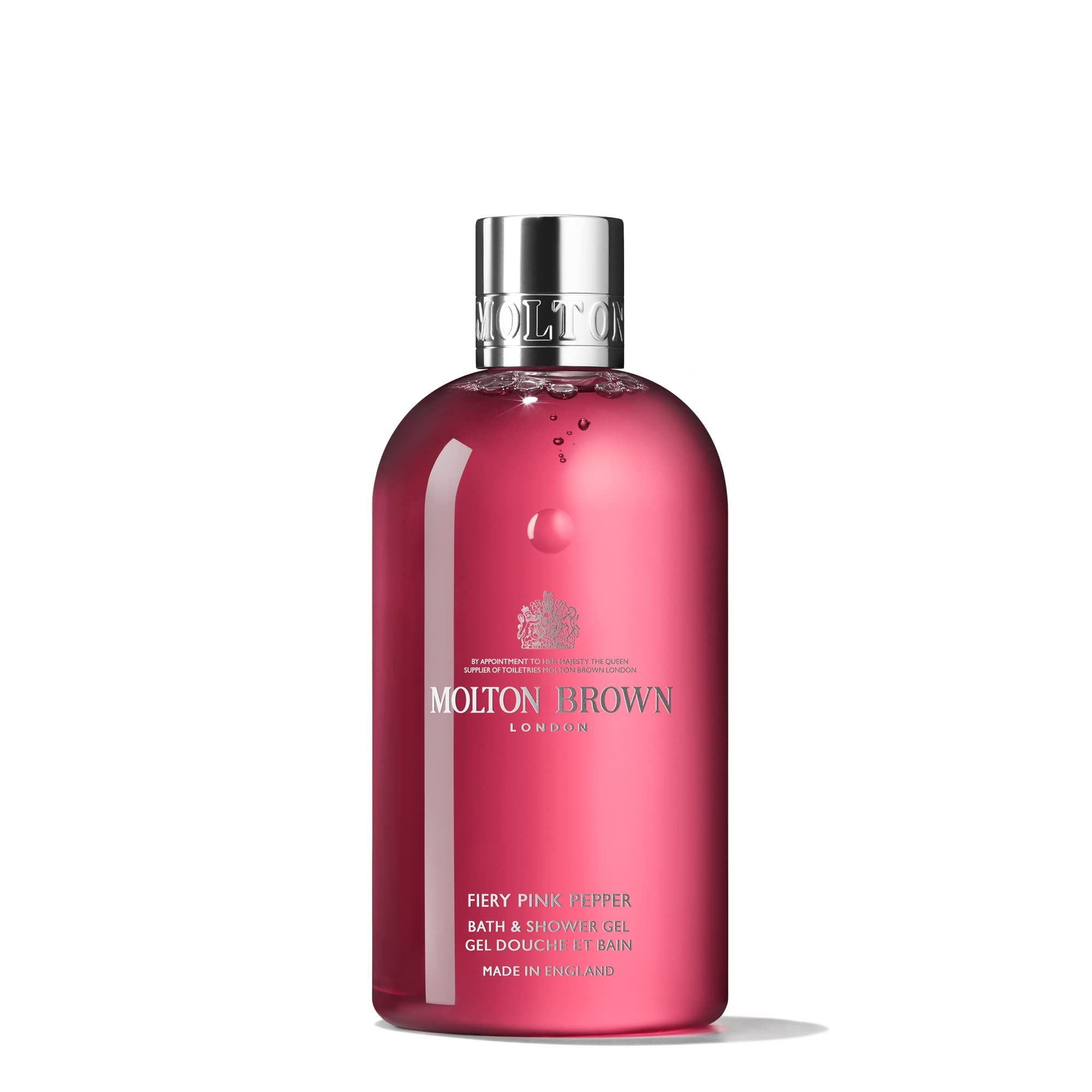 Molton Brown Fiery Pink Pepper Bade- & Duschgel Flasche. Rosa Flüssigkeit, silberner Deckel. Logo und Text.