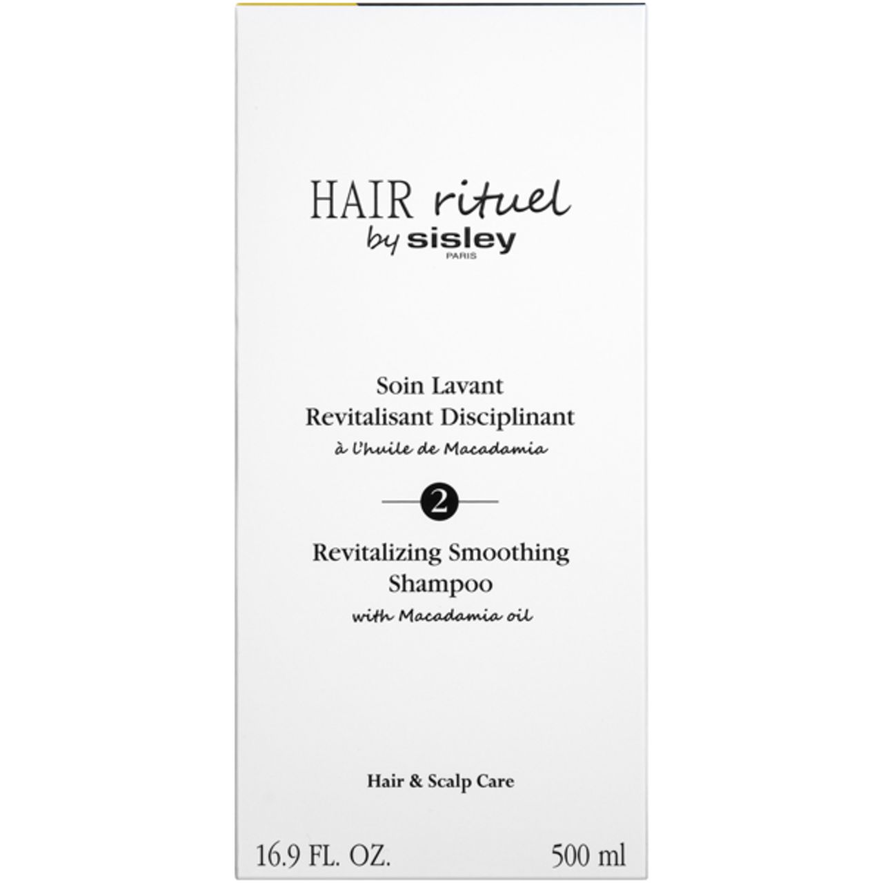 Weiße Verpackung mit Produktbezeichnung und Marke: Hair Rituel by Sisley. Revitalisierendes Shampoo. 16.9 FL. OZ. und 500 ml.