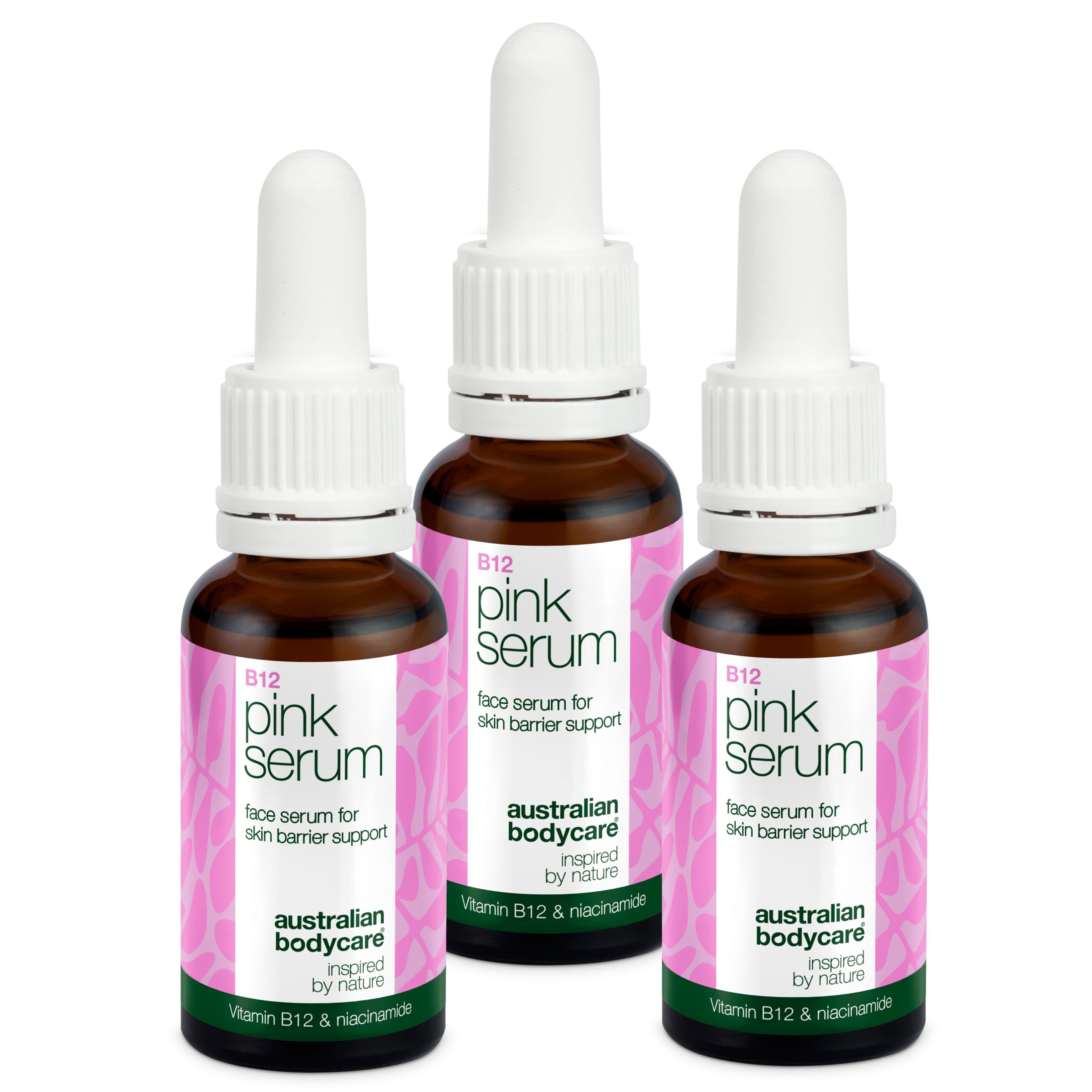 Drei Flaschen Australian Bodycare B12 Pink Serum. Braune Glasflaschen mit weißem Tropfer und rosa Etikett.