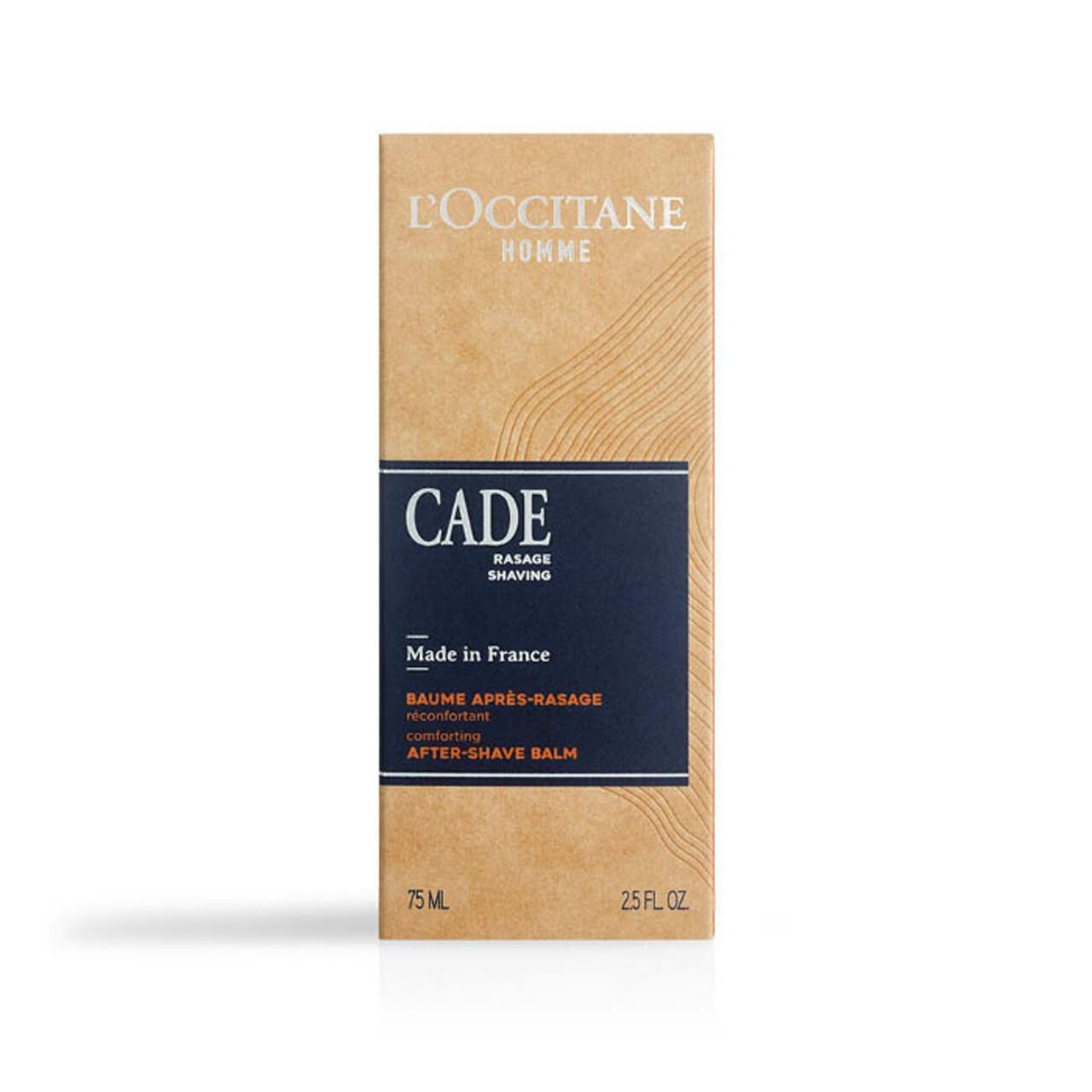 Braune Schachtel mit blauem Etikett. Aufschrift: CADE, After-Shave Balsam, 75 ml, 2.5 FL. OZ. Marke: L'Occitane.