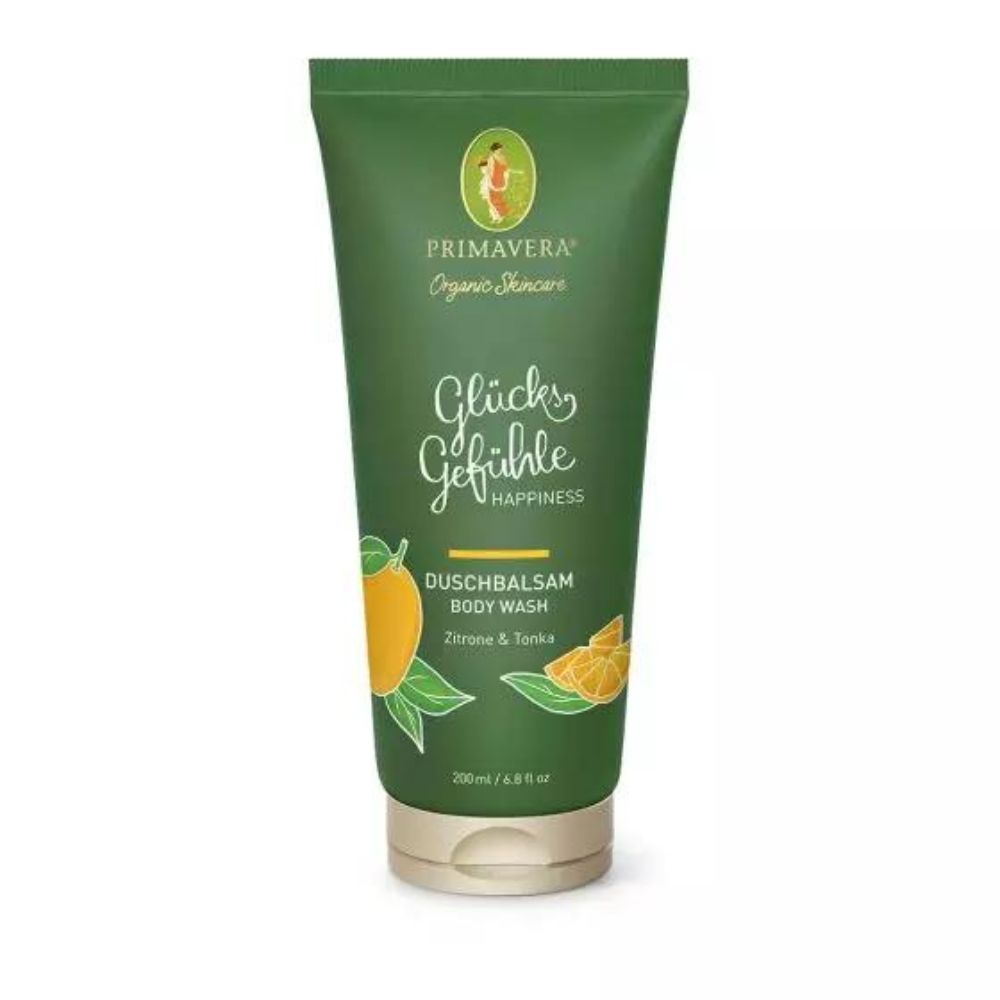 Tubo verde di Duschbalsam Primavera. Scritta: Glücksgefühle, Duschbalsam, Zitrone & Tonka. Illustrazioni di limone. Chiusura beige.