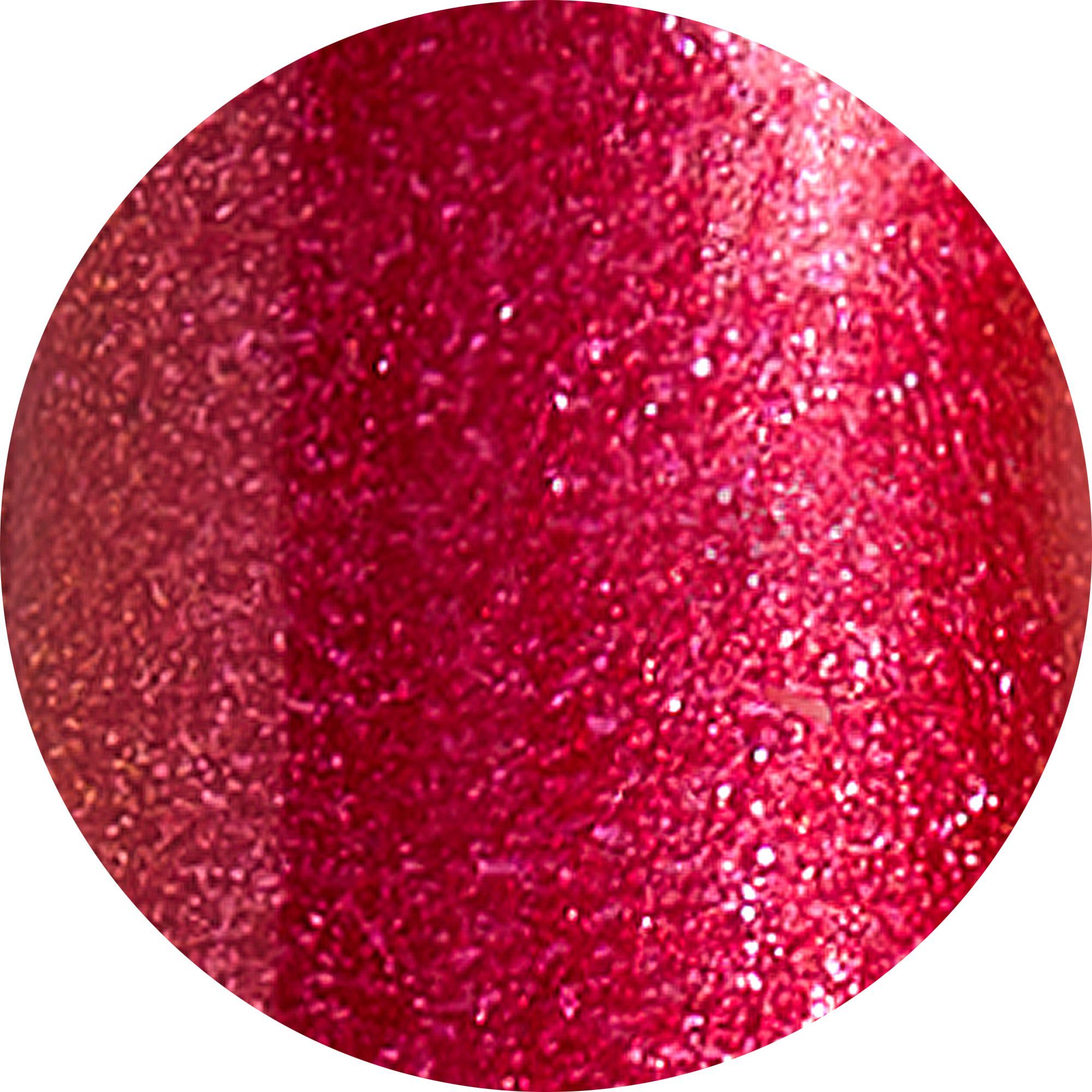 Macchia rotonda di rossetto rosso con glitter.