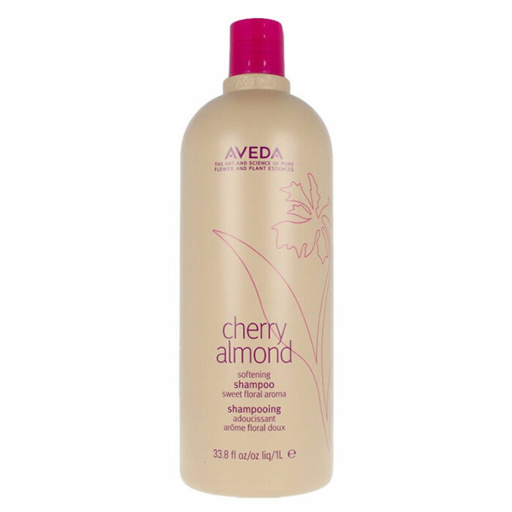 Beige Shampoo-Flasche mit pinkfarbenem Deckel. Aufschrift: Aveda, Cherry Almond, Shampoo. 33.8 fl oz/1L.
