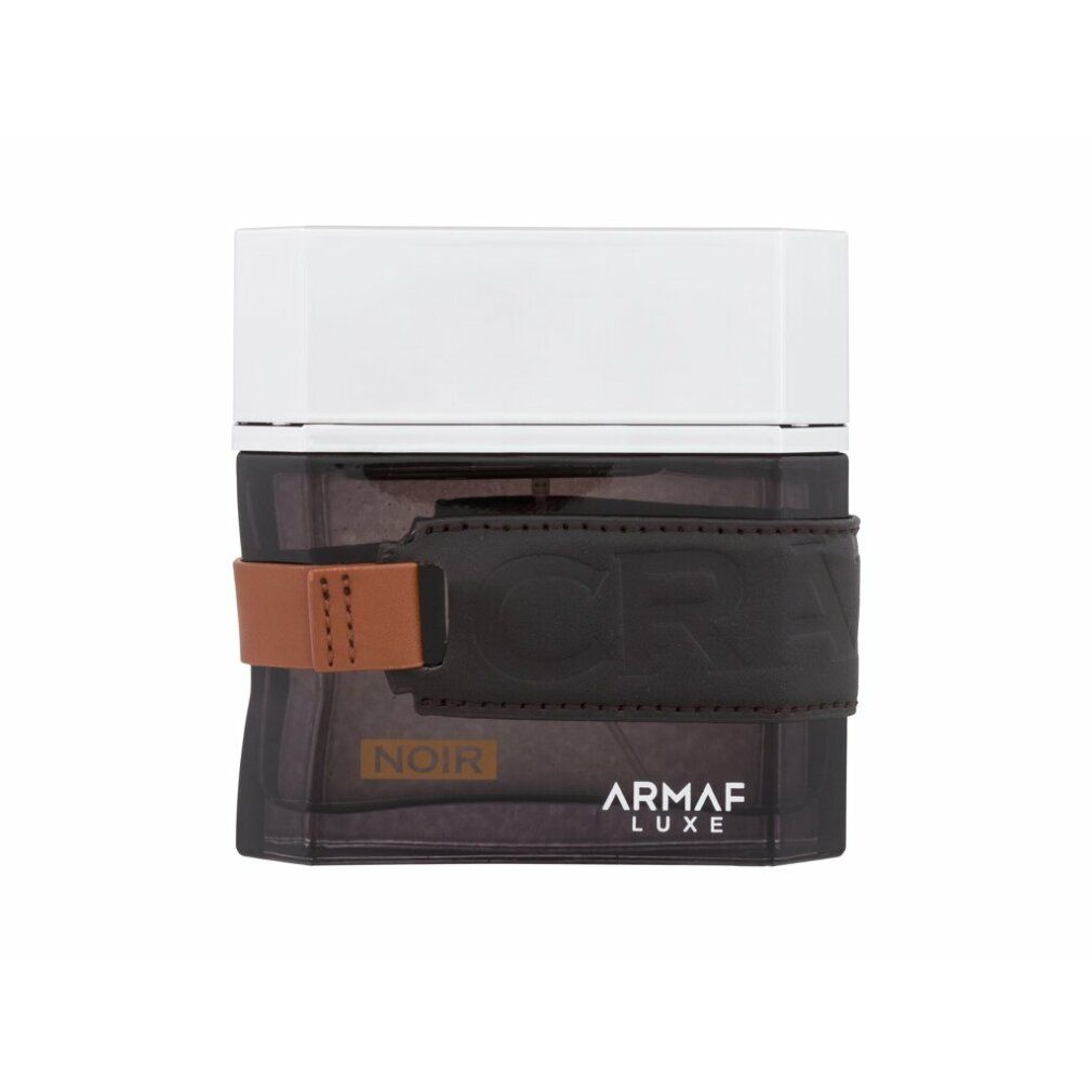 Schwarzer Flakon mit braunem Lederband und silbernem Deckel. Aufschrift: Noir, Armaf Luxe.