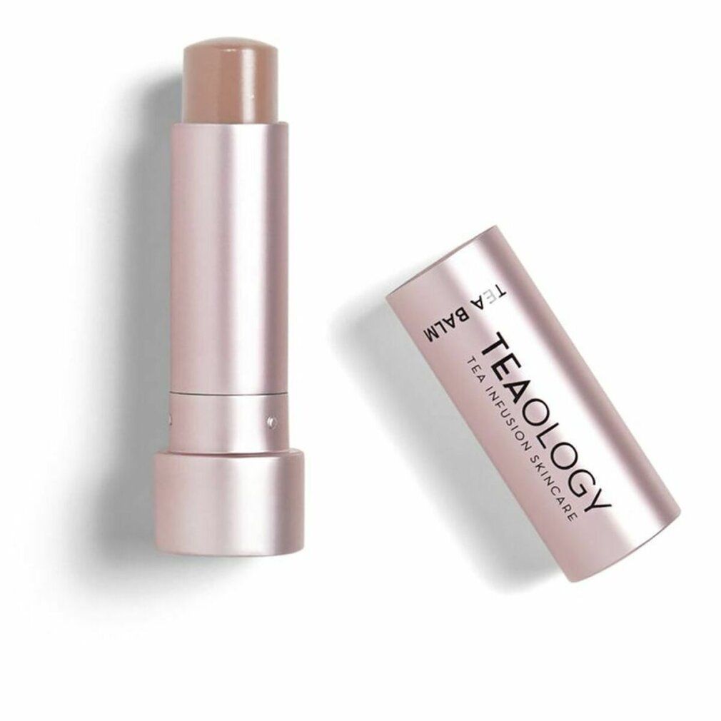 Lippenbalsam in rosafarbenem Stift. Der Deckel ist abgenommen und zeigt den Markennamen TEAOLOGY. Der Lippenbalsam ist hellbraun.