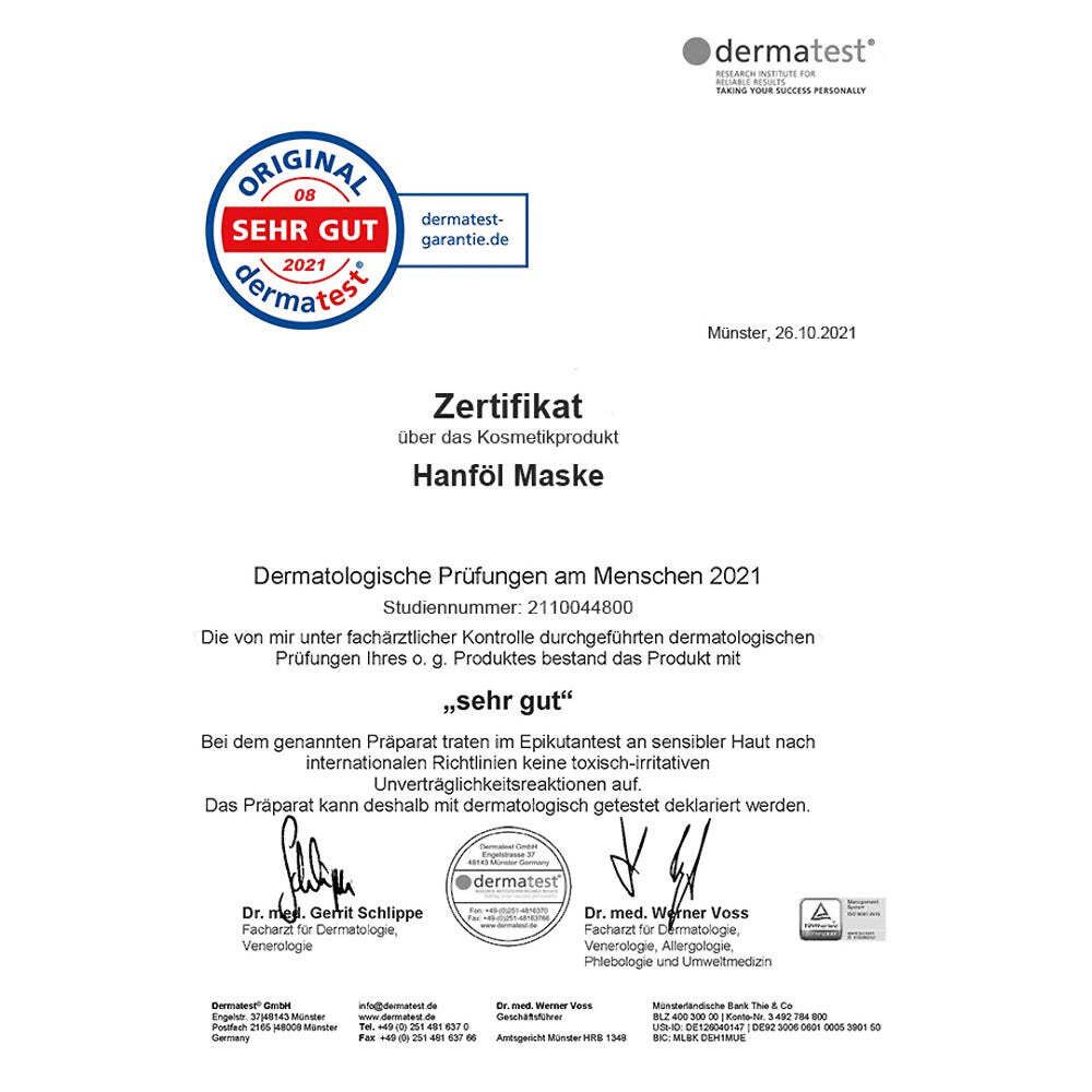 Zertifikat der Dermatest GmbH. Siegel: Sehr Gut. Text: Zertifikat über die Kosmetikprodukt Hanföl Maske. Dermatologische Prüfungen am Menschen 2021.
