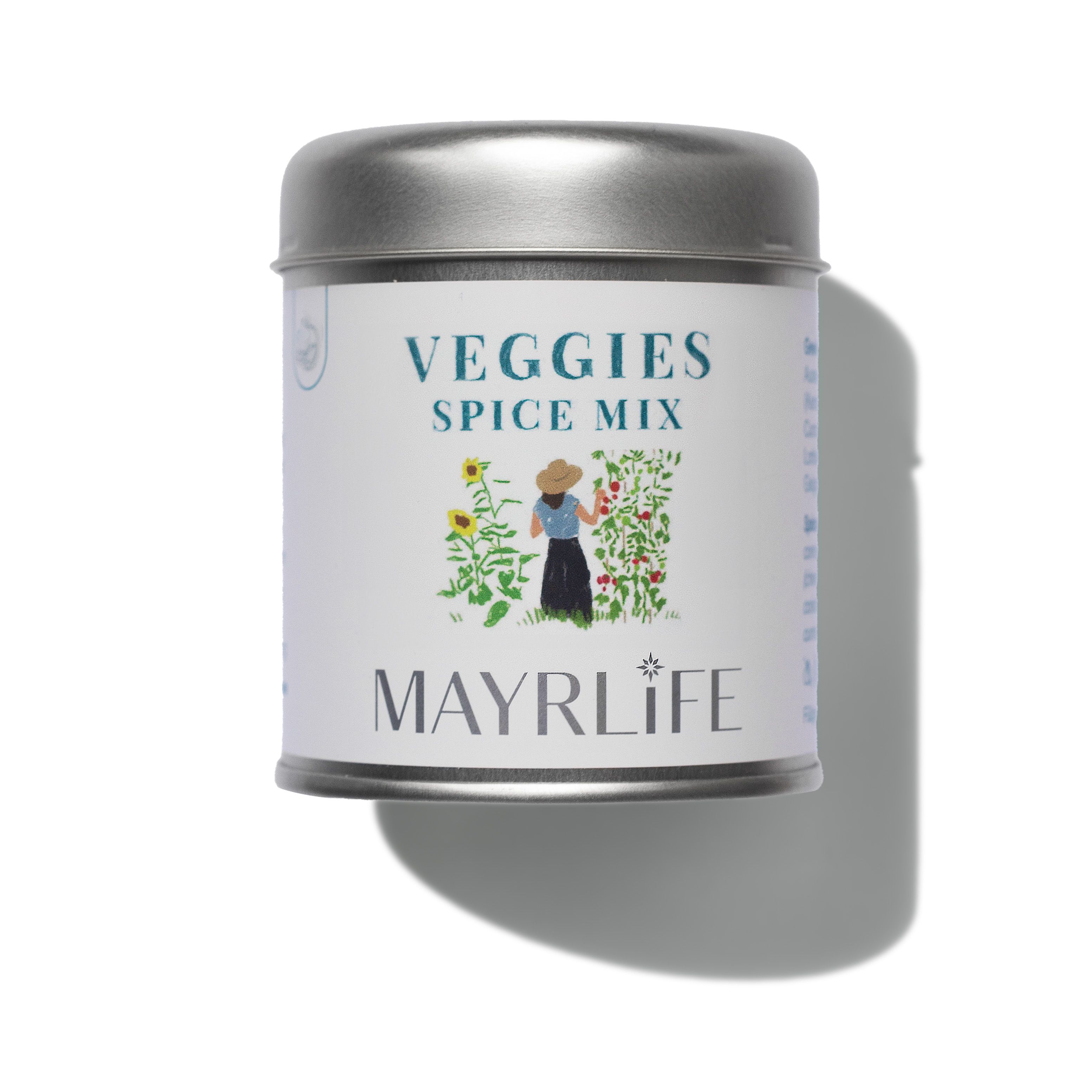 Runder Metallbehälter mit Deckel. Aufschrift: VEGGIES SPICE MIX. Illustration einer Person im Garten. MAYRLIFE-Logo.