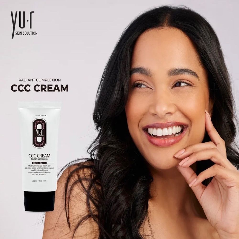 Yu.r CCC Cream Tube neben einer lächelnden Frau. Schwarze Schrift. 50ml/1.69 FL.OZ.