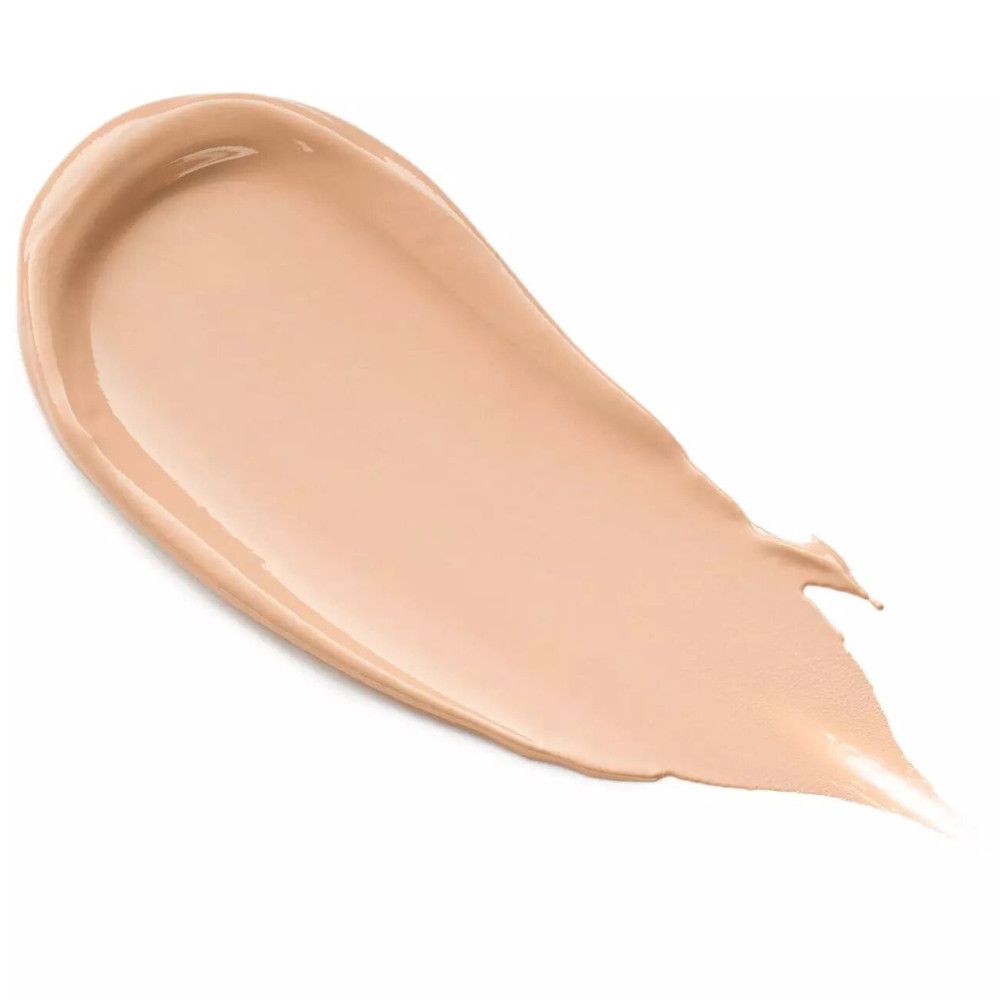 Beigefarbener Camouflage-Creme-Strich. Die Textur ist cremig und glatt. Der Strich verläuft von oben links nach unten rechts.