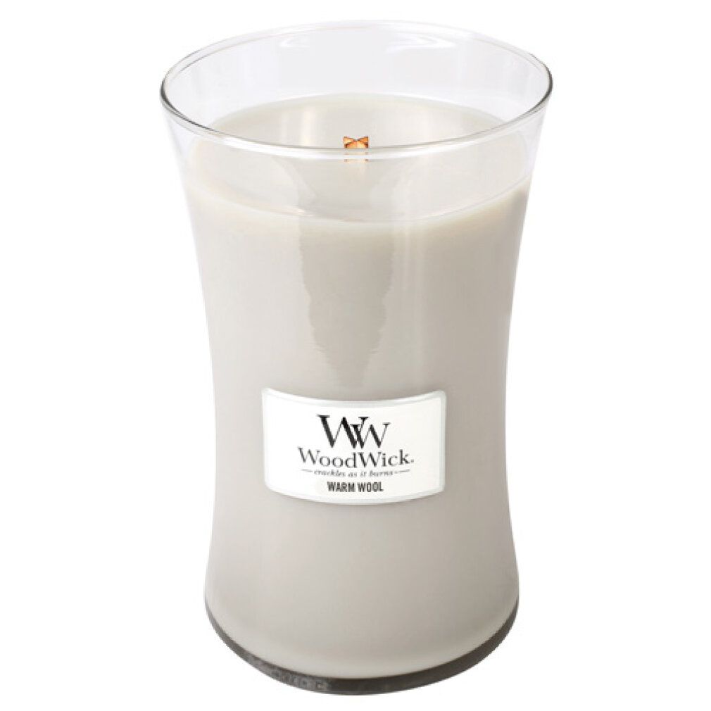 Kerze in Glasbehälter. Aufkleber mit "Warm Wool" und Logo. Graue Kerze in klarer Glasform mit Holzdocht.