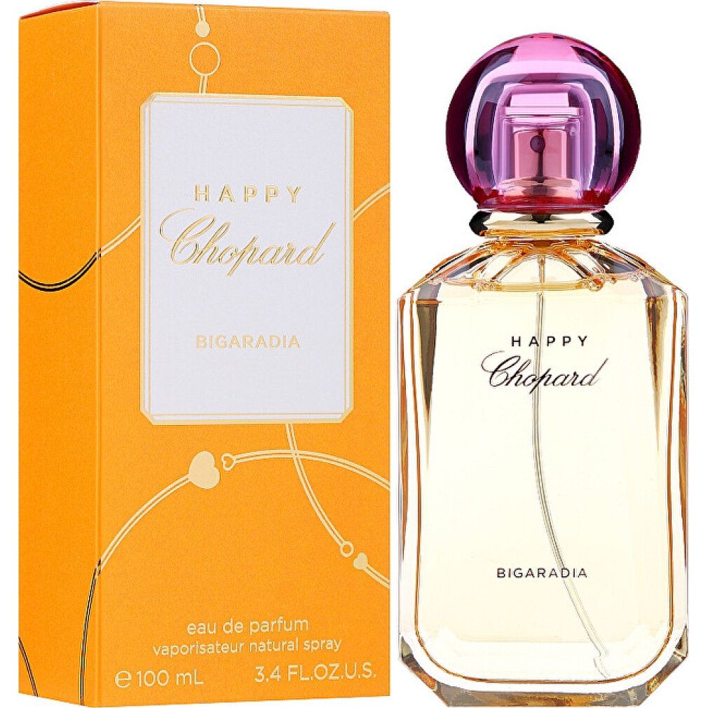 Parfümflakon und Verpackung. Flakon mit rosa Verschluss, goldfarbenem Glas. Verpackung orange mit weißem Etikett und Schriftzug Happy Chopard.