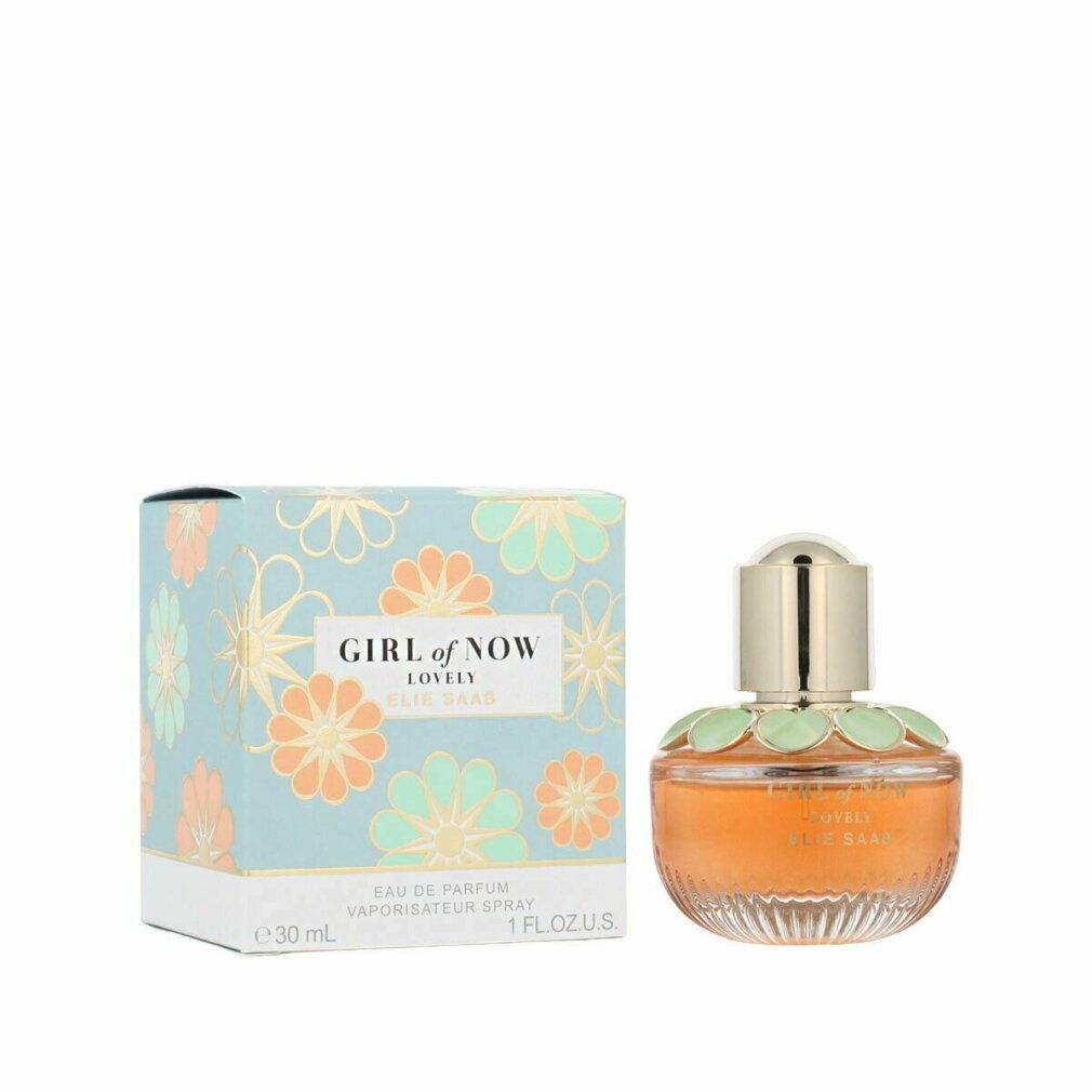 Parfümflasche und Schachtel. Flasche mit goldener Kappe, orangefarbener Flüssigkeit, grünen Blütenblättern. Schachtel mit Blumenmuster.