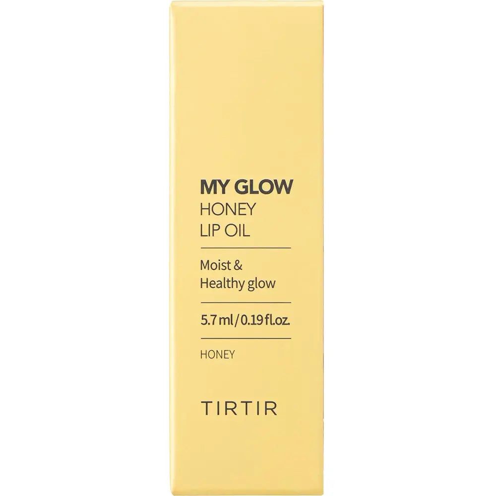 Verpackung von TIR TIR My Glow Lip Oil Honey. Gelber Karton mit Produktnamen und Text. 5,7 ml/0,19 fl.oz.