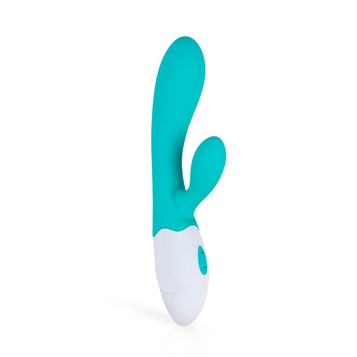Vibrateur turquoise et blanc. Forme ergonomique avec deux éléments de stimulation. Base blanche avec bouton de commande.