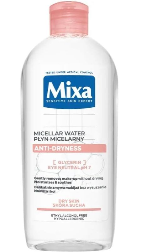 Mixa Mizellenflüssigkeit. Transparente Flasche mit rosa Verschluss. Blaue und rosa Etiketten mit Produktinformationen.