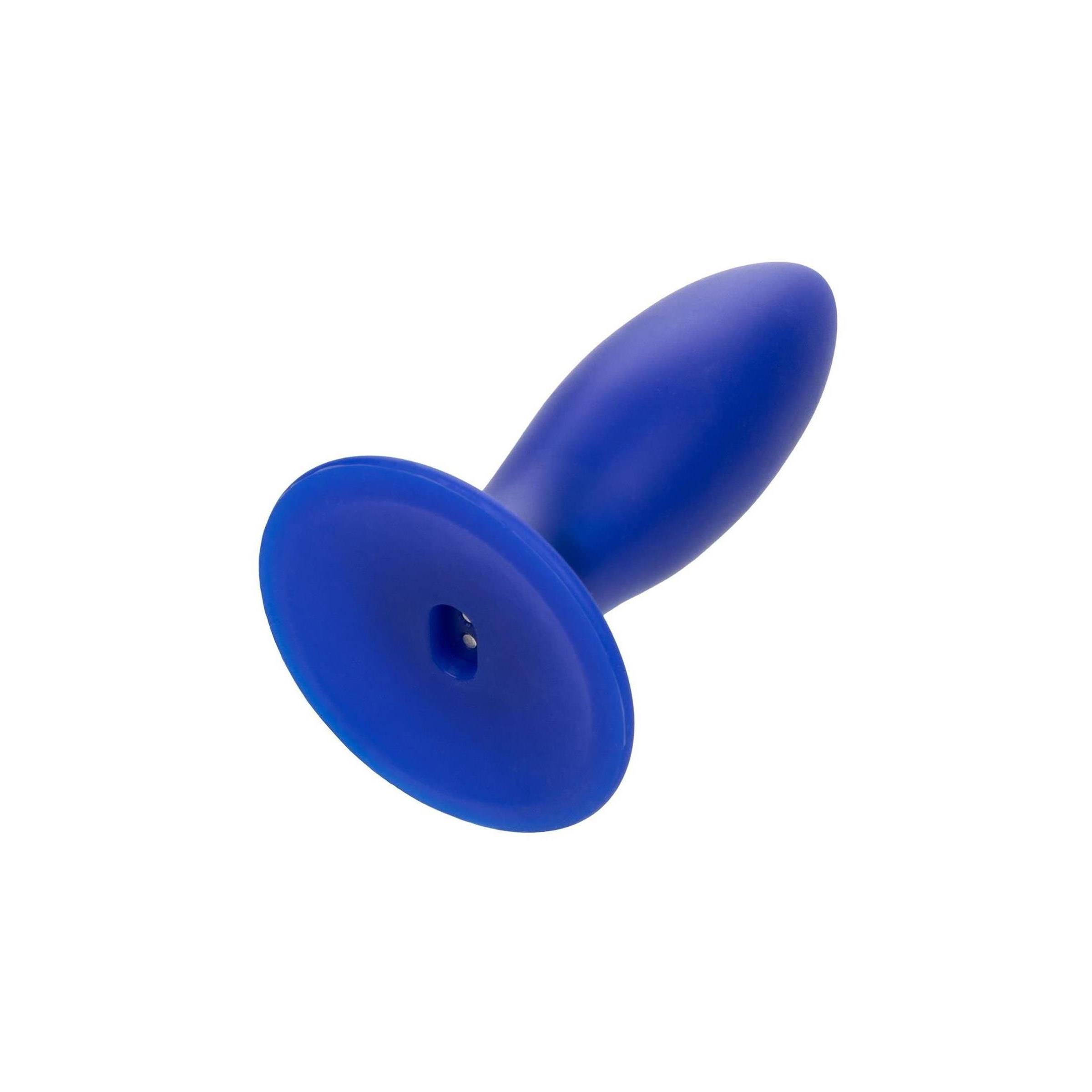 Blaues, torpedoförmiges Produkt. Abgerundete Spitze, breite Basis. Auf der Basis befindet sich ein Knopf.