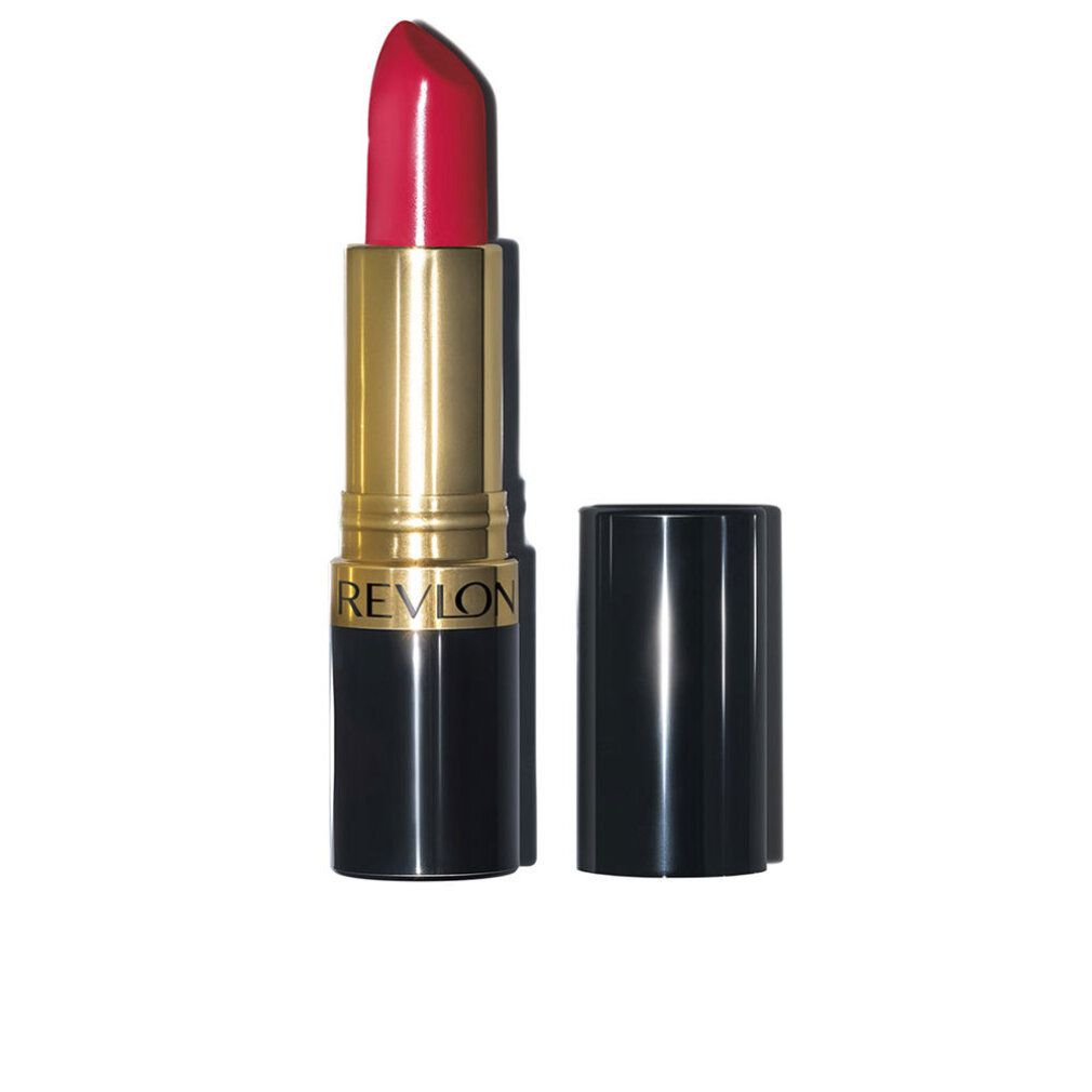Lippenstift mit roter Spitze. Goldfarbener Mittelteil, schwarzer Boden. Deckel daneben. Aufschrift: REVLON.