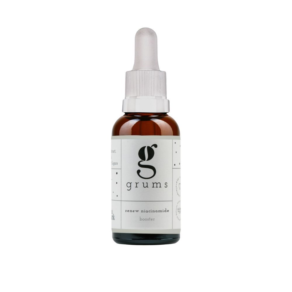 Braune Glasflasche mit Pipette. Auf dem Etikett steht "grums" und "renew niacinamide booster".