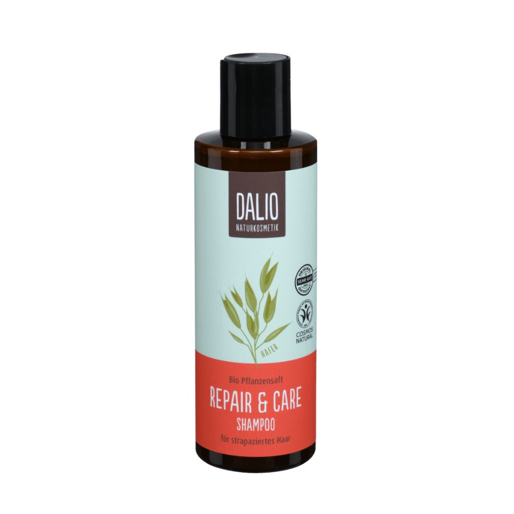 Braune Flasche mit schwarzem Deckel. Aufschrift DALIO, Repair & Care Shampoo. COSMOS NATURAL-Zertifizierung.
