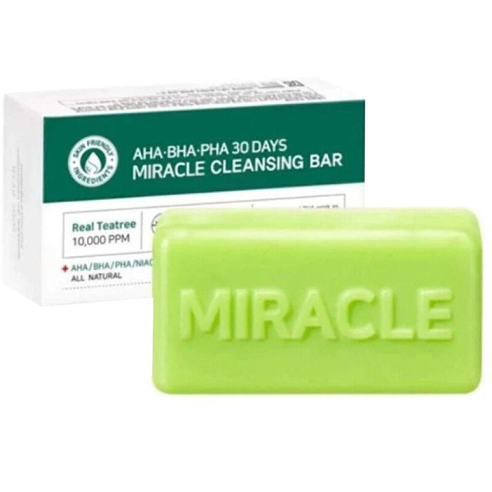 Grünes Seifenstück und Verpackung. Auf dem Seifenstück steht "MIRACLE". Die Verpackung zeigt Produktinformationen.