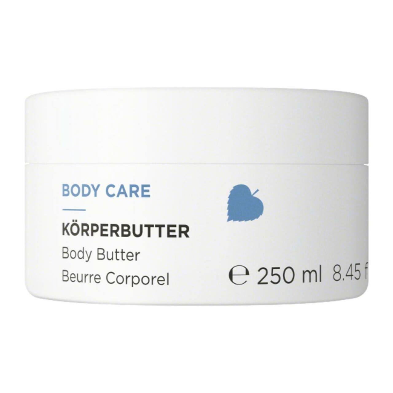 Weiße Dose mit Aufschrift BODY CARE, KÖRPERBUTTER, Body Butter, Beurre Corporel. Blaue Blatt-Grafik. 250 ml.