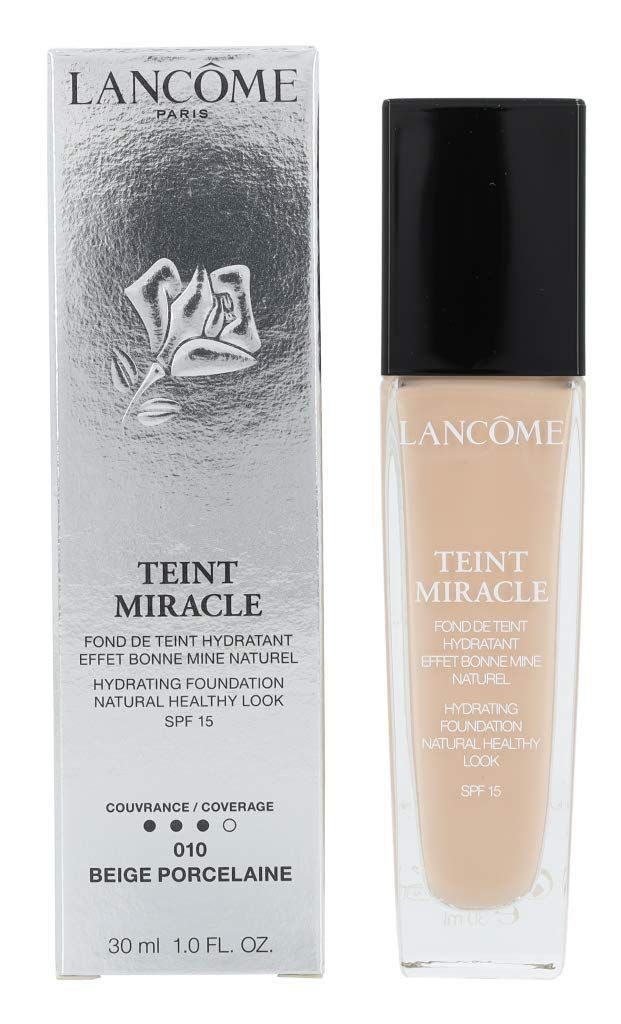 Lancôme Teint Miracle SPF 15 Foundation und Verpackung. Beige Foundation-Flakon neben silberner Schachtel. Produktname und SPF 15.