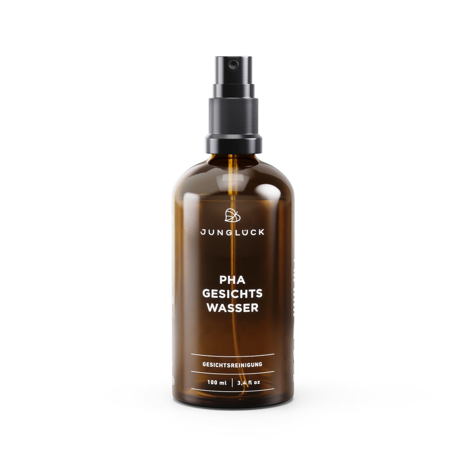 Braune Glasflasche mit schwarzem Sprühkopf. Beschriftung: JUNGLÜCK, PHA GESICHTSWASSER, GESICHTSREINIGUNG. 100 ml.